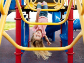 girl-playing-on-playground-by-Allison-McSorley